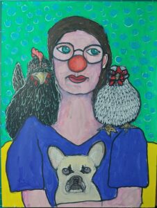 Clownin mit Hund und Hühnern